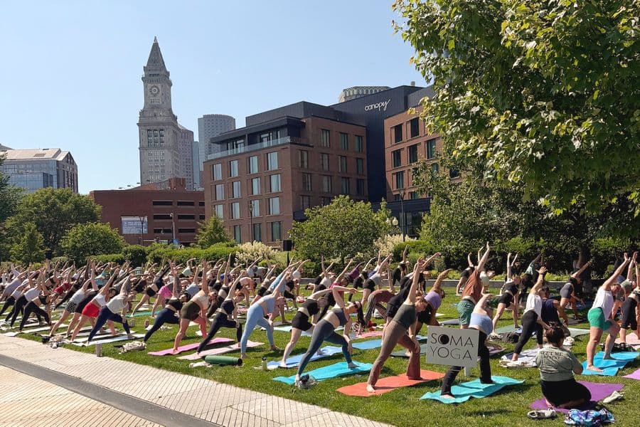 An outdoor yoga class in Boston, MA