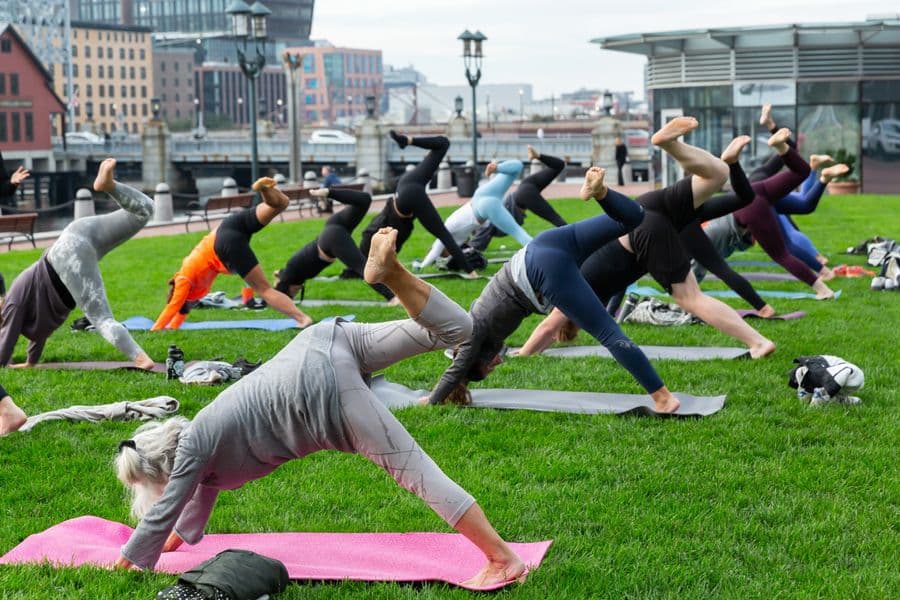 An outdoor yoga class in Boston, MA